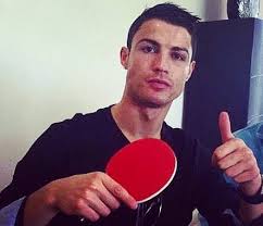 Cristiano Ronaldo holding a table tennis racket